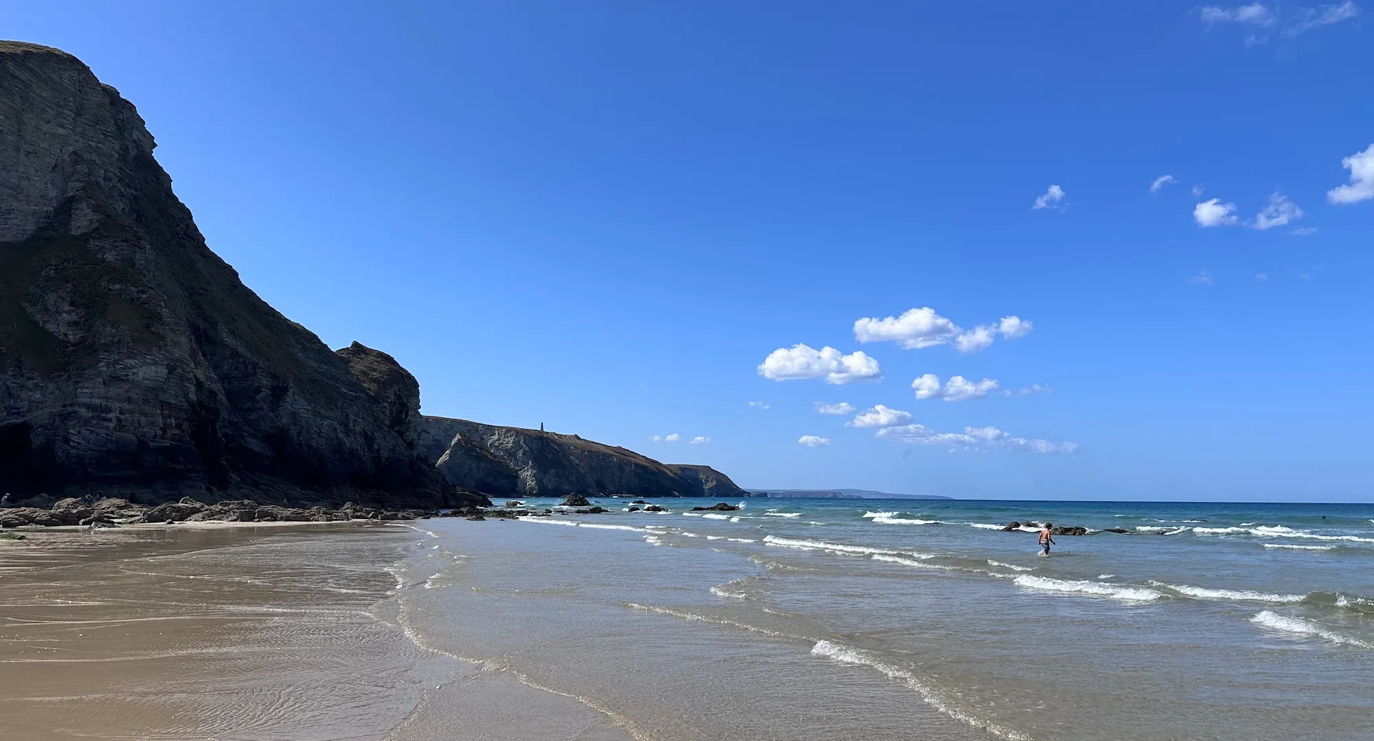 Beach with cliffs in the background
